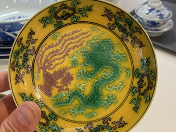 A pair of Chinese yellow-ground turquoise- and aubergine-glazed 'dragon and phoenix' plates, Qianlong mark, 19/20th C.
