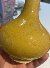 A Chinese monochrome yellow-glazed bottle vase with incised dragon design, Daoguang mark, 19/20th C.