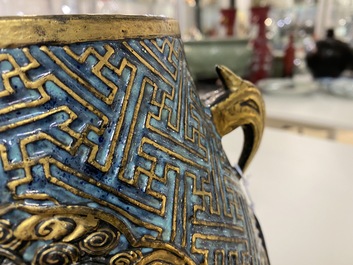 Un vase de forme 'hu' en porcelaine de Chine aux &eacute;maux imitant le bronze et 'robin's egg', marque de Qianlong, 19&egrave;me
