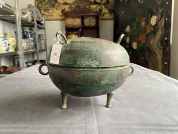 A Chinese bronze ritual tripod 'dui' food vessel and cover, Eastern Zhou