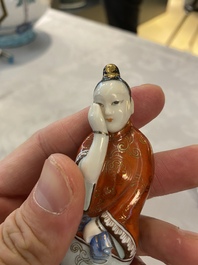 A Chinese polychrome porcelain 'reclining lady' snuff bottle, 19th C.