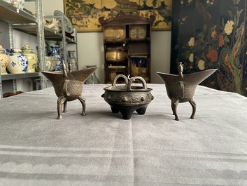 Two Chinese small bronze 'jue' ewers and a tripod censer, probably Yuan