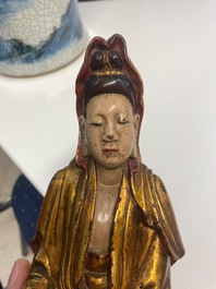 A Vietnamese gilded, lacquered and painted wooden figure of Guanyin, 18/19th C.