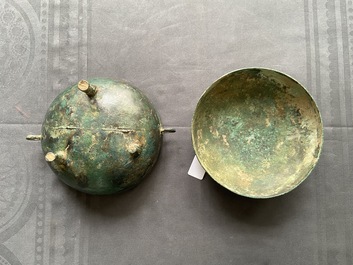 A Chinese bronze ritual tripod 'dui' food vessel and cover, Eastern Zhou