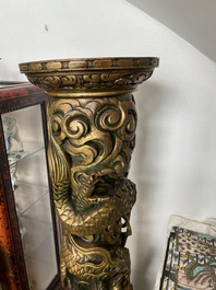 A large Chinese gilded wooden 'dragon' stand, 19th C.
