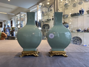 A pair of Chinese monochrome celadon vases with gilt bronze mounts, 18/19th C.