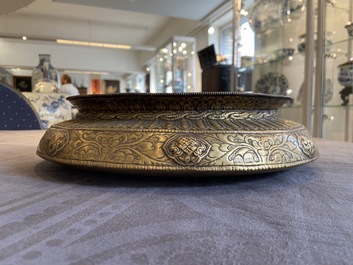 A Tibetan brass ewer, an alms bowl and an Indian bronze ewer, 18/19th C.