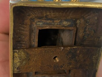 A pair of Chinese gilt bronze Buddhist lions on champlev&eacute; enamel bases, 18/19th C.