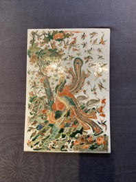 A Chinese famille verte plaque with a phoenix surrounded by other birds, 19th C.