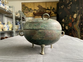 A Chinese bronze ritual tripod 'dui' food vessel and cover, Eastern Zhou