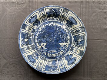 A large Chinese blue and white kraak porcelain dish with a finely painted jardini&egrave;re, Wanli