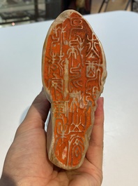 A Chinese Shoushan soapstone seal group depicting figures beneath a mountain, 19th C.