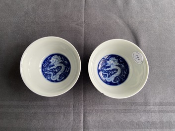A pair of Chinese blue and white 'dragon' bowls, Kangxi mark, 19/20th C.