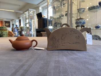 Two Chinese Yixing stoneware teapots with engraved inscriptions, 20th C.