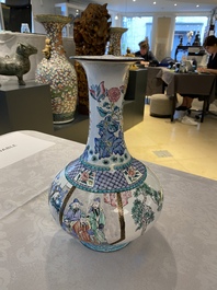 A Chinese Canton enamel bottle vase, Qianlong mark, 19th C.