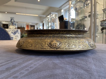 A Tibetan brass ewer, an alms bowl and an Indian bronze ewer, 18/19th C.