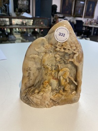 A Chinese Shoushan soapstone seal group depicting figures beneath a mountain, 19th C.