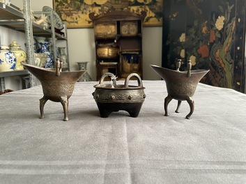 Two Chinese small bronze 'jue' ewers and a tripod censer, probably Yuan