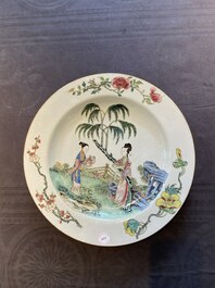 A large Chinese famille rose dish with ladies in a garden, Yongzheng