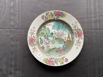 A Chinese famille rose dish with pipe-smoking fishers along the water, Yongzheng