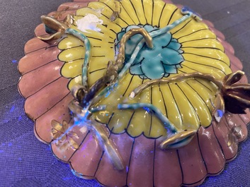 A lobed Chinese gilded famille rose 'lotus' cup and saucer and one depicting roosters, Yongzheng/Qianlong