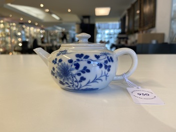 A small Chinese blue and white teapot with floral design, 19th C.