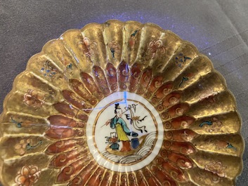 A lobed Chinese gilded famille rose 'lotus' cup and saucer and one depicting roosters, Yongzheng/Qianlong