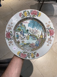 A Chinese famille rose dish with pipe-smoking fishers along the water, Yongzheng