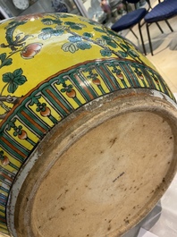 A Chinese yellow-ground famille verte 'dragons' fish bowl on gilded wooden stand, 19th C.