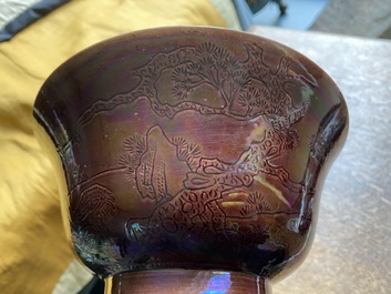 A Chinese aubergine-glazed bowl with incised design of cranes, Kangxi
