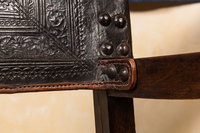 A pair of Spanish walnut chairs with leather backs and seats, 17th C.