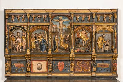 A large Flemish polychrome walnut retable, probably Ghent, dated 1529