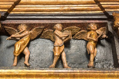 A large Flemish polychrome walnut retable, probably Ghent, dated 1529