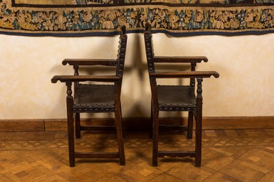 A pair of Spanish walnut chairs with leather backs and seats, 17th C.