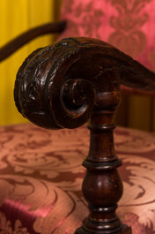 A wooden armchair with red velvet lining, 18th C.