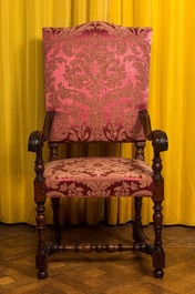 A wooden armchair with red velvet lining, 18th C.