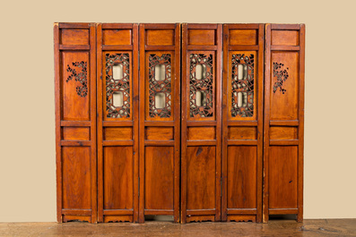 A Chinese six-panel screen in painted, gilt and reticulated wood, 19th C.