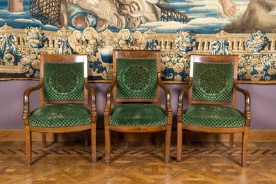 A green-upholstered carved wooden salon set with a two-seater, a fauteuil and three armchairs, 19th C.