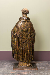 A polychromed and gilt walnut figure of a friar, Spain, 17th C.