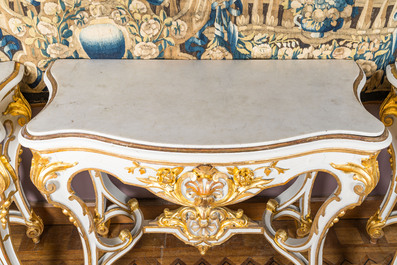 A pair of painted and gilt wooden rocaille console tables and a jardini&egrave;re, France, 19/20th C.