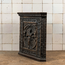 A small dark-patinated wooden corner cabinet with a shepherdess, 17th C. and later