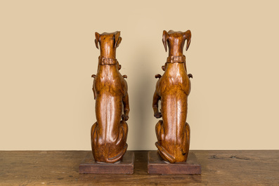 A pair of English wooden greyhounds with a shield, 19th C.
