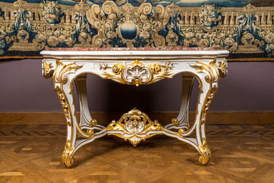 An attractive partly gilt wooden table with marble top, Italy, 18/19th C.