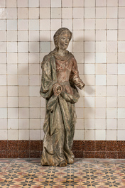 A large polychrome wooden sculpture of a female saint, early 17th C.