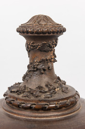 A patinated carved wooden urn and cover, probably France, 19th C.