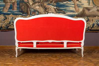 A partly gilt wooden sofa and four armchairs with red velvet upholstery, 18/19th C.