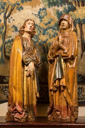 Two large Flemish polychromed and gilt walnut figures of Mary and John the Baptist, Brabant, late 15th C.