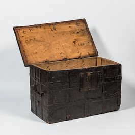 A wrought iron-mounted wooden coffer with leather upholstery, 17th C.