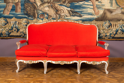 A partly gilt wooden sofa and four armchairs with red velvet upholstery, 18/19th C.