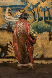 A polychrome wooden sculpture of a saint, 17th C.